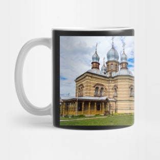 Orthodox Church against bright blue sky Mug